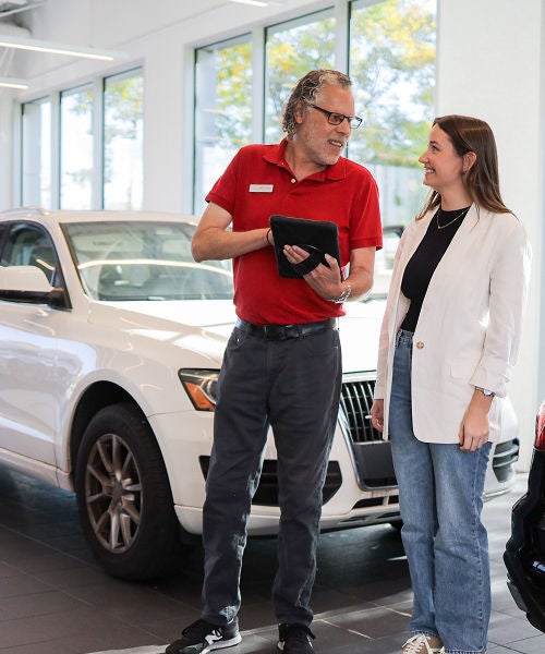 Rear profile view of an Audi Q5 parked.