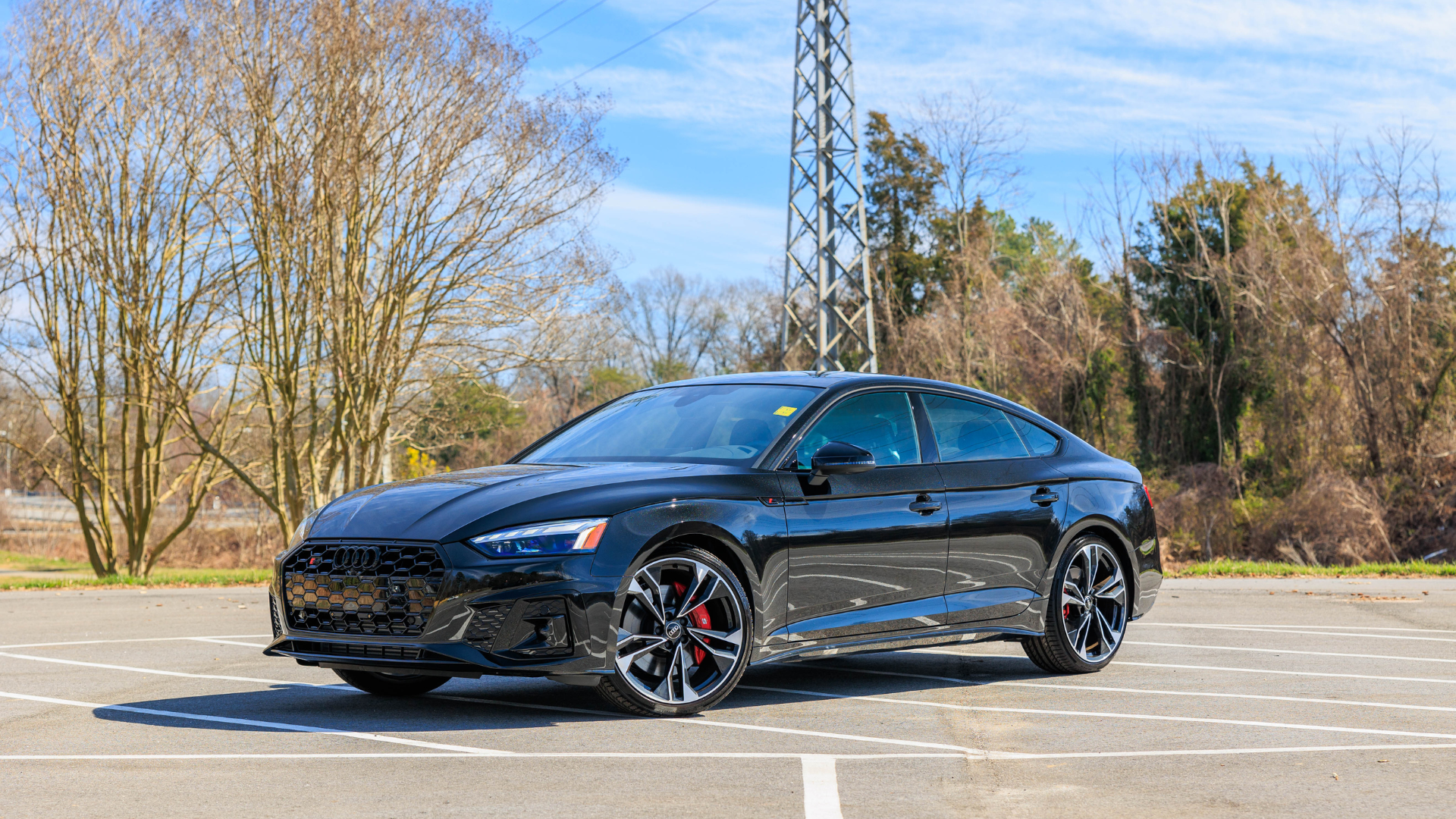 Black Audi S5 parked in an empty lot