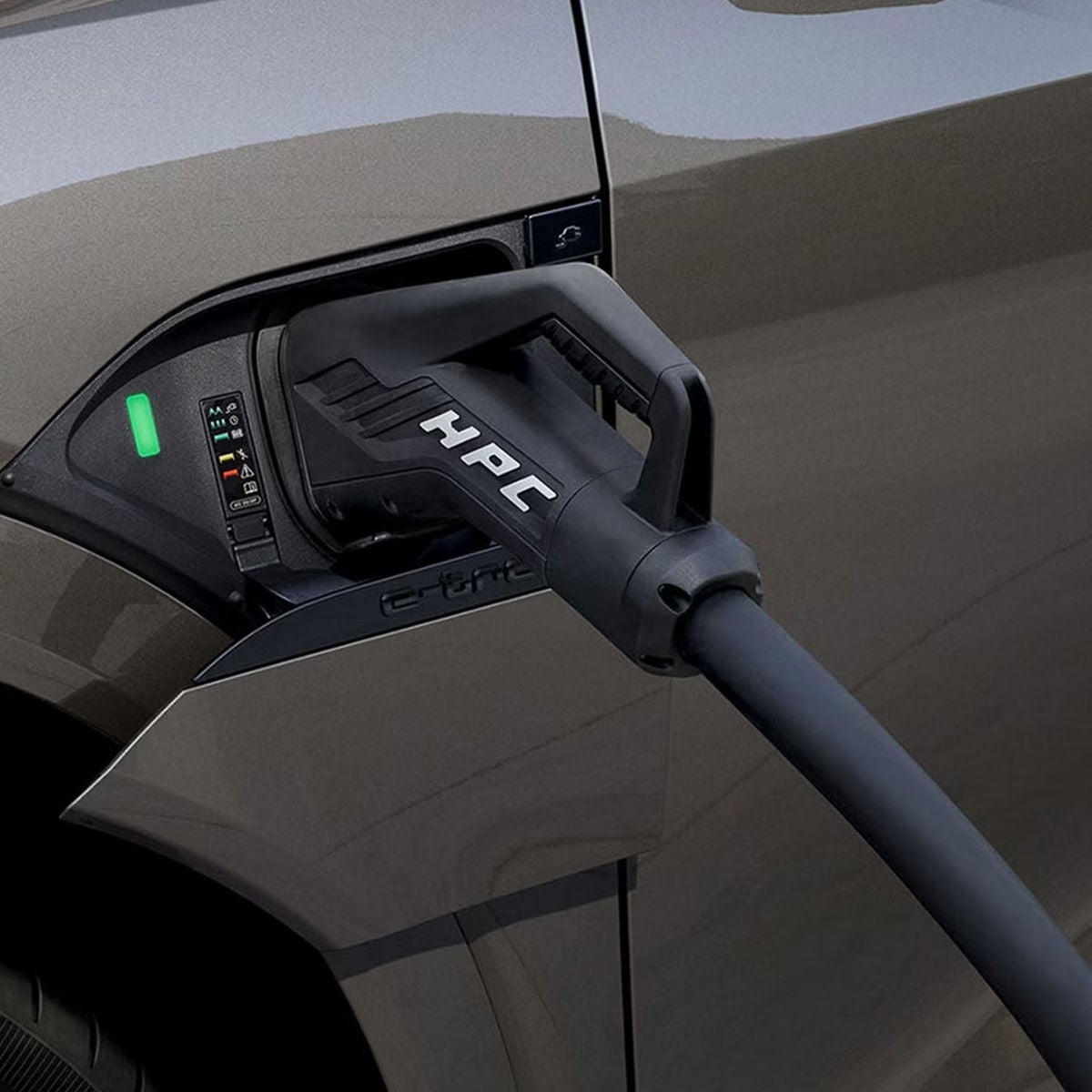 Close-up on the charging port on an Audi e-tron vehicle.