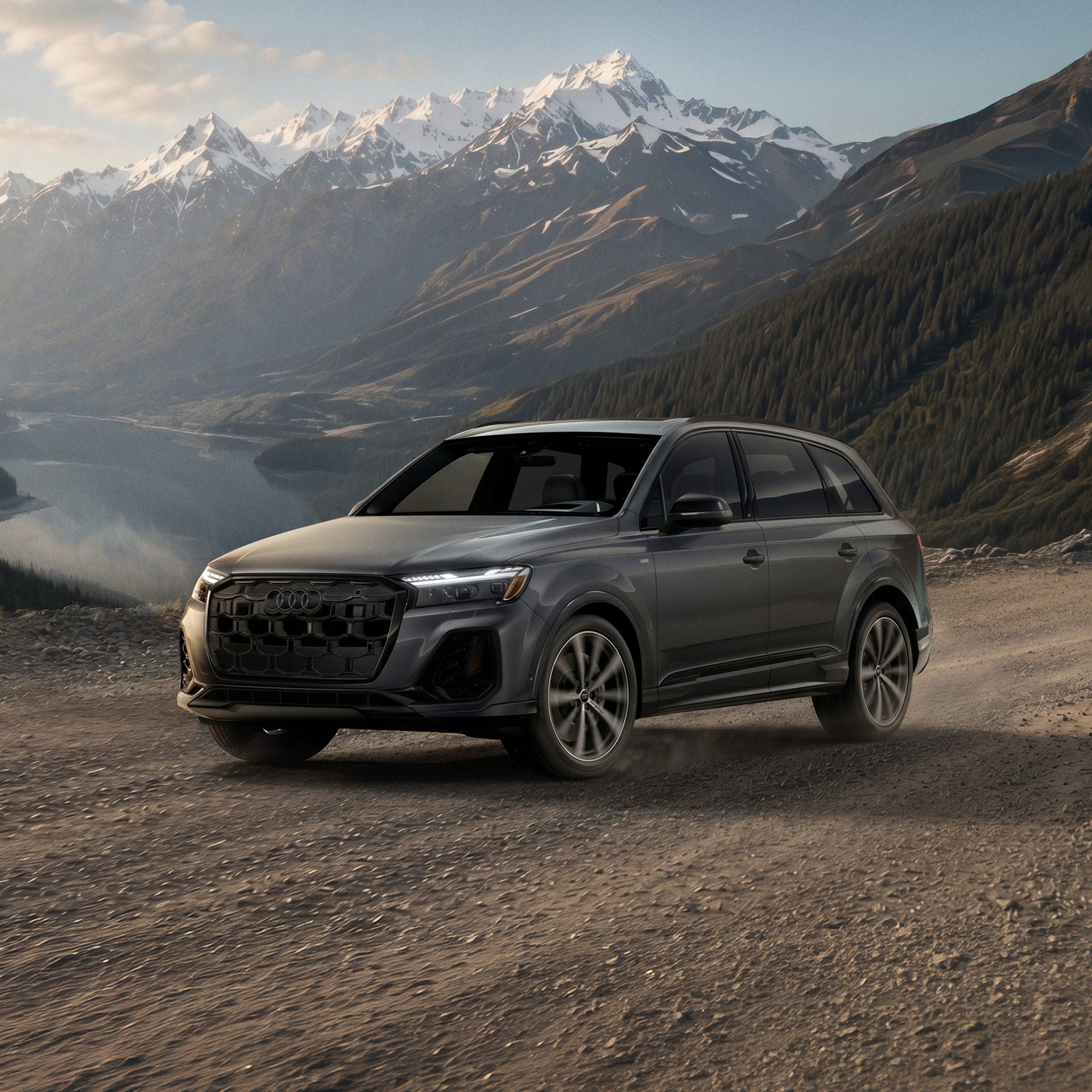 Three-quarter front profile of an Audi Q7 accelerating.