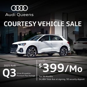 Side left profile view of an Audi Q3 parked.