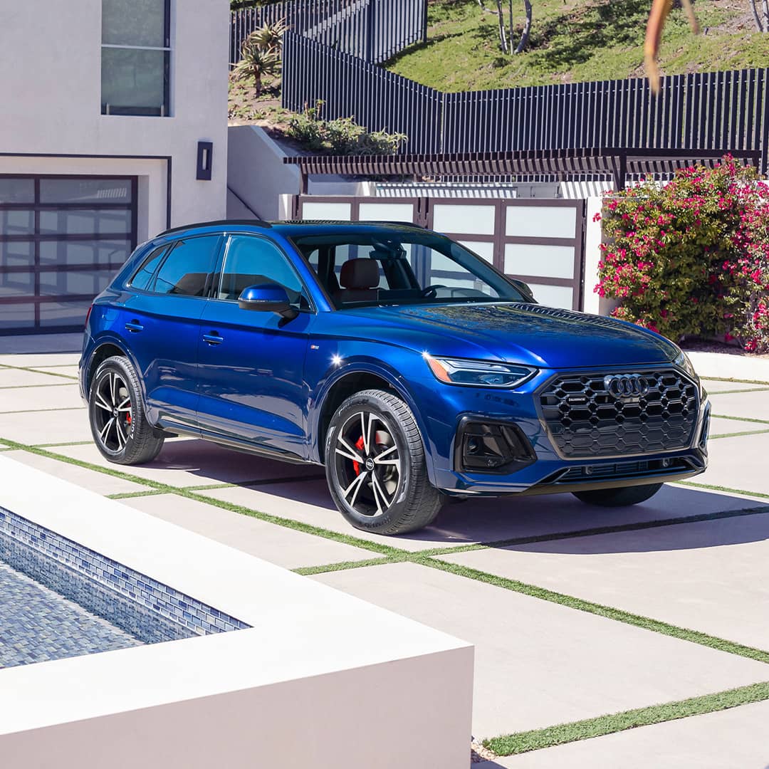 Three quarter profile view of an Audi Q5 parked.