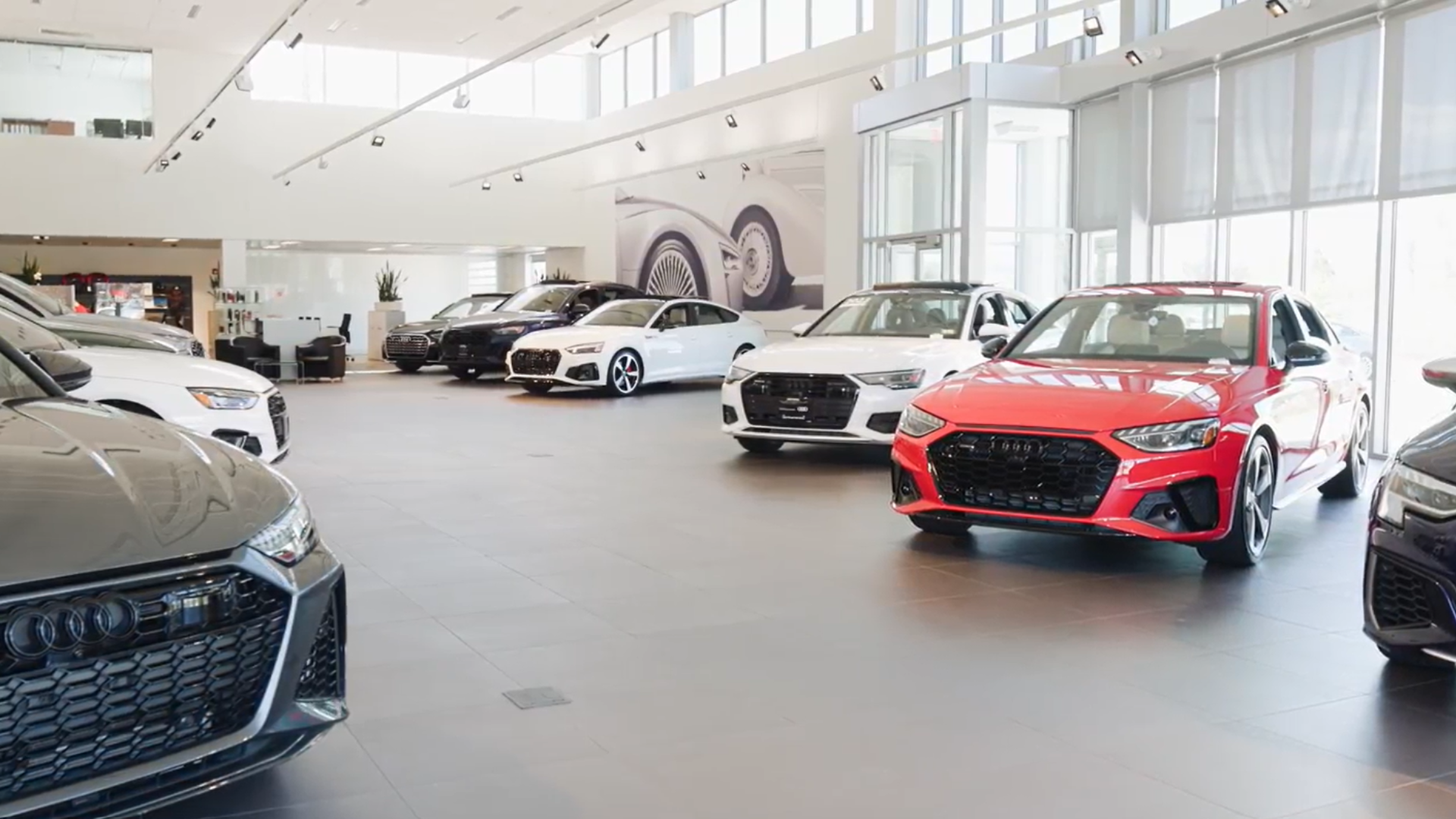 View of cars inside an Audi dealership.