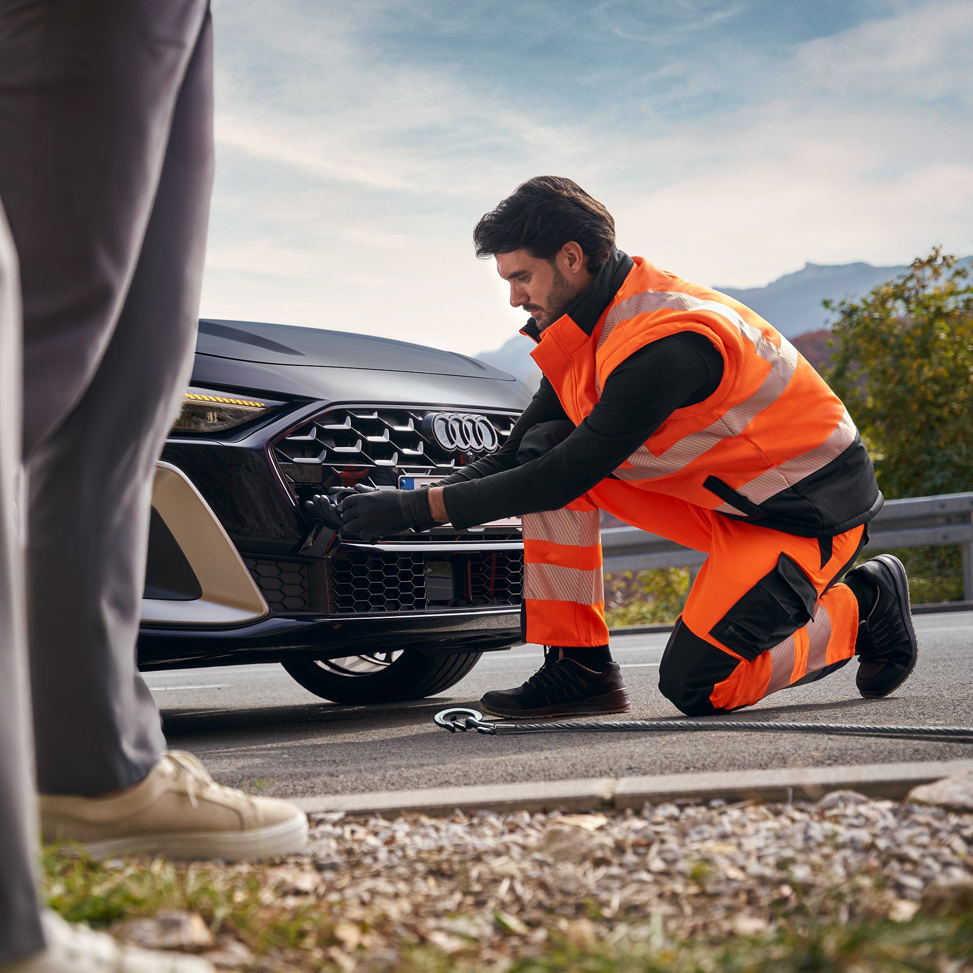 A man opening the door of an Audi A5 Coupe.