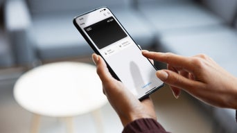 A man using the myAudi app on his tablet. 