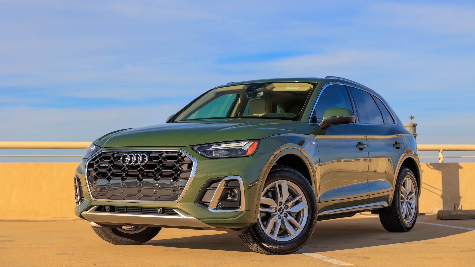 Three quarter view of an Audi q7 vehicle parked.