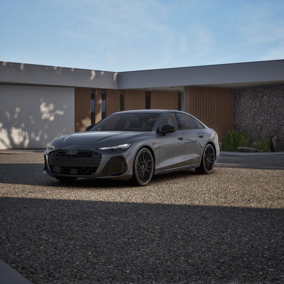 Front 3/4 view of the Audi A6 Sedan parked. 