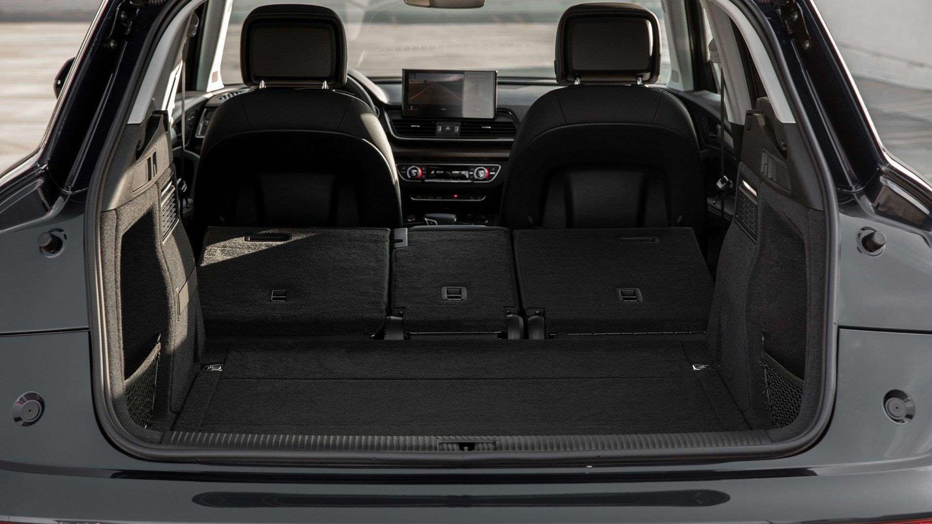 Interior view of an Audi Q5's trunk storage.