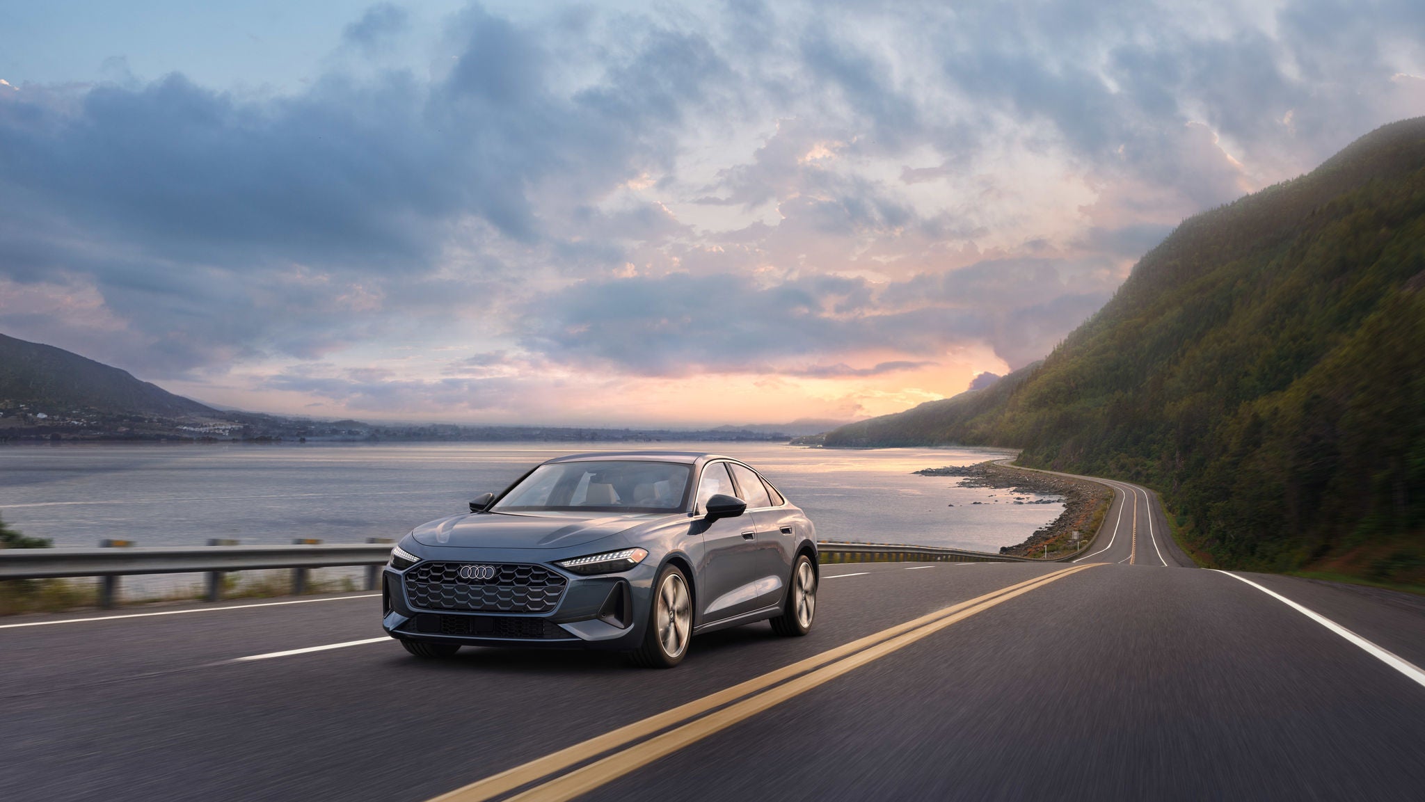 Right profile view of an Audi A5 driving.