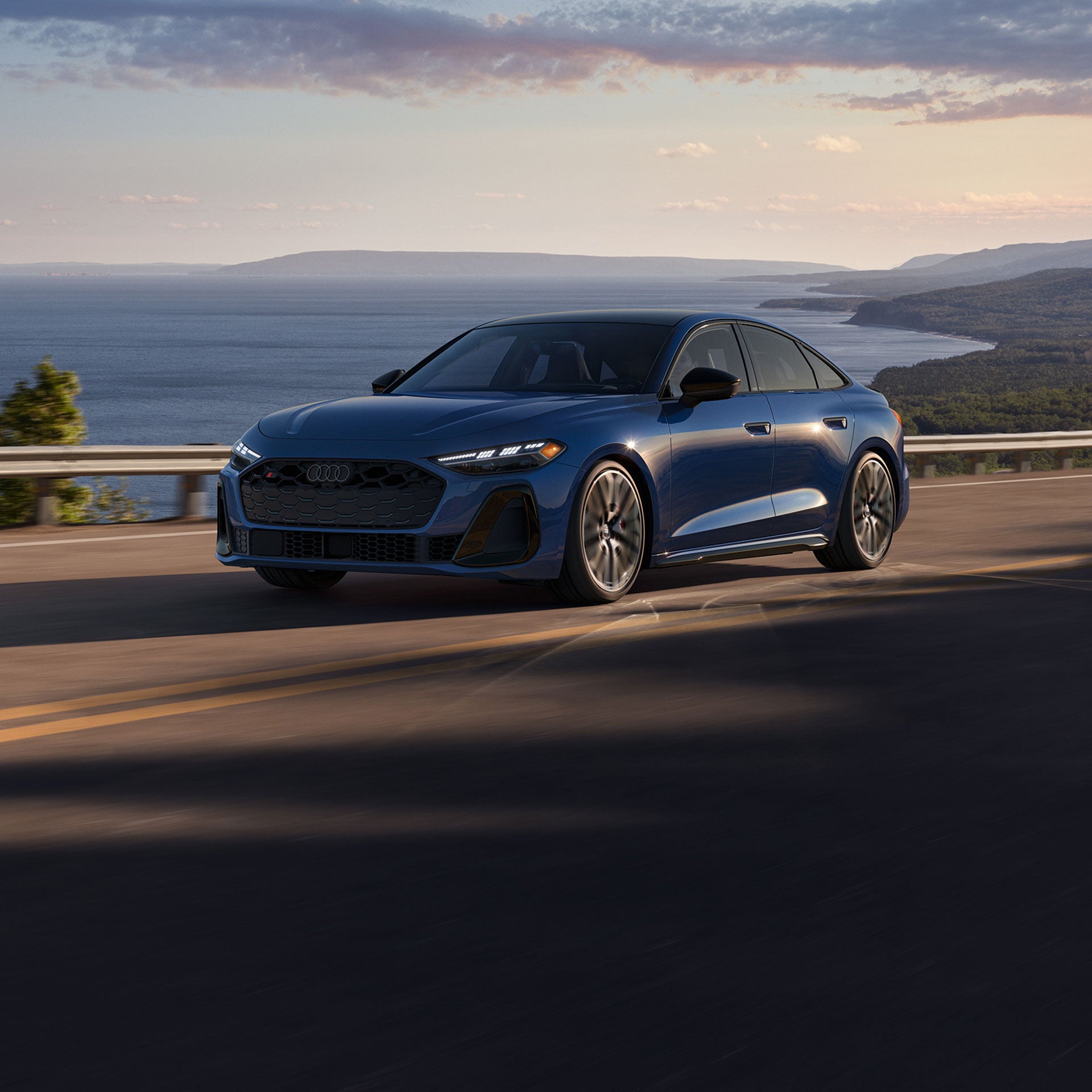 Three-quarter front view of the all-new Audi S5 in motion.