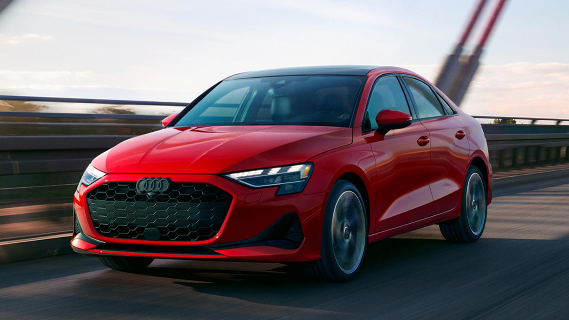 Front profile view of an Audi vehicle accellerating.