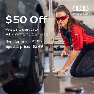 Audi technician performing an alignment service