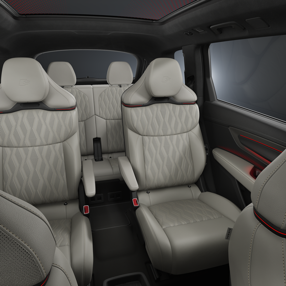 A view of the interior, focusing on the two rear rows of seats.