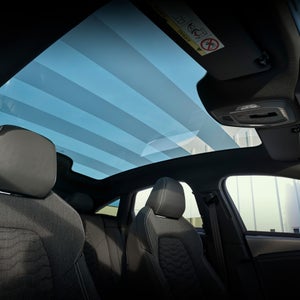 Interior view of the Audi S6 e-tron cabin, showing the panoramic sunroof.