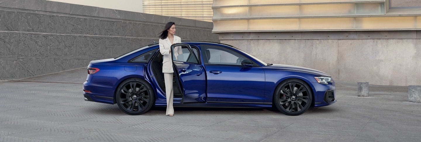 Woman gets out of her Audi S8