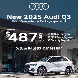 Side view of an Audi Q3 parked.