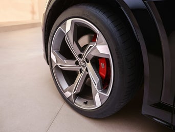 Audi technician servicing a vehicle 
