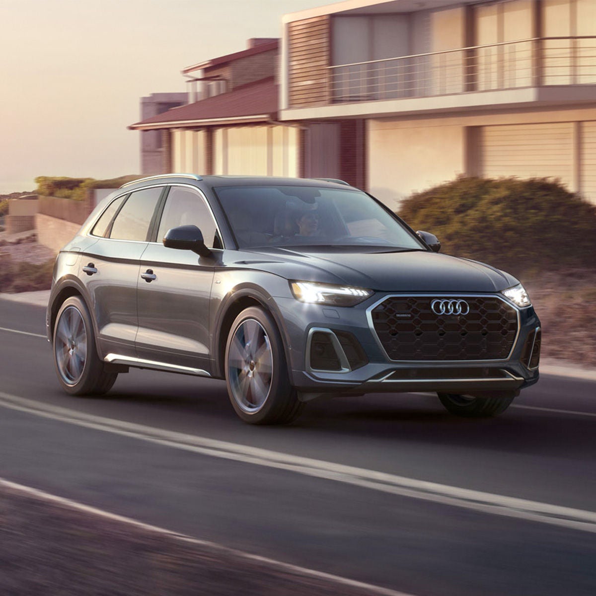 Front 3/4 shot of the 2025 Audi Q5 parked in driveway.