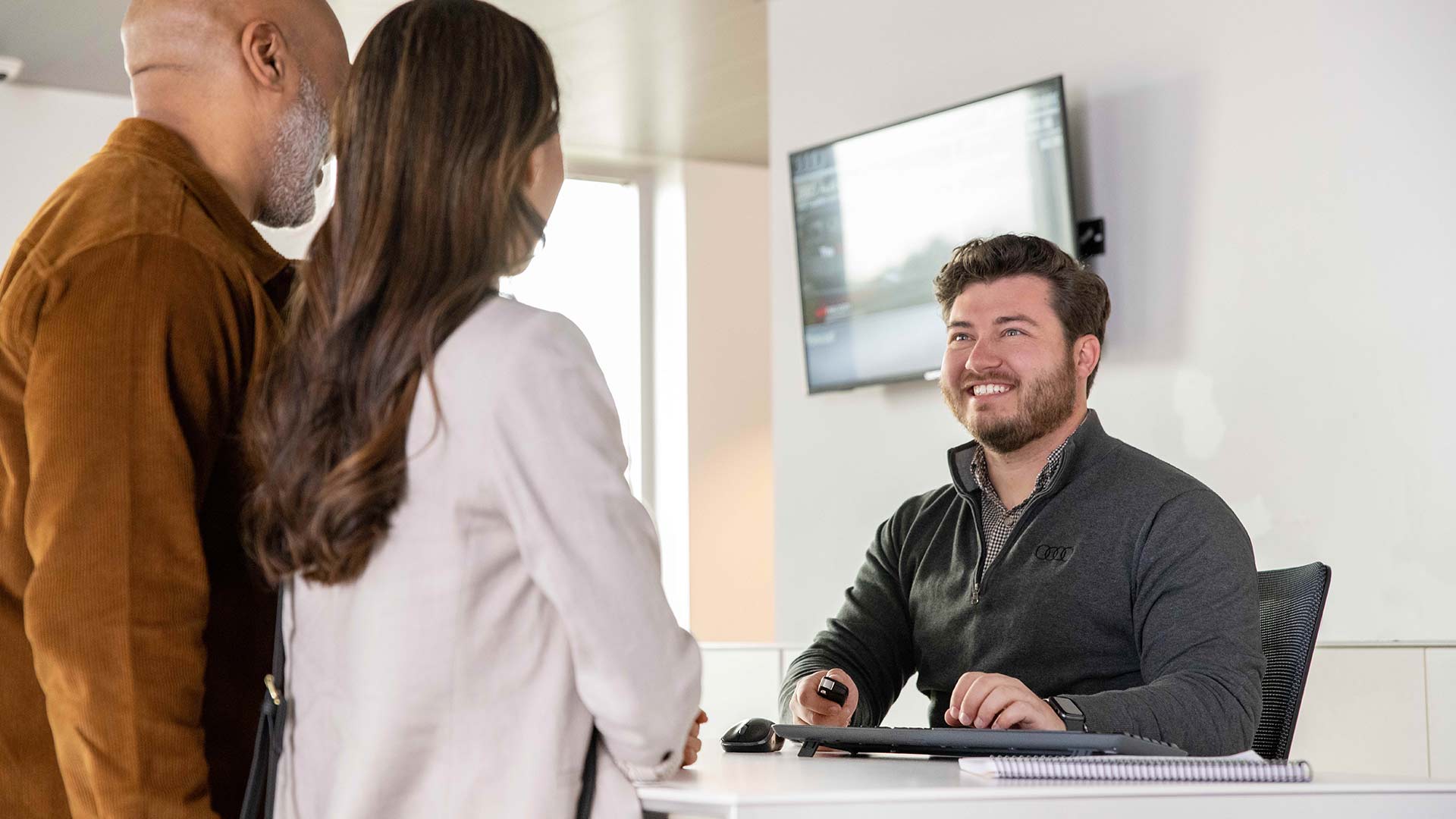 Couple at the service of an auto dealership.