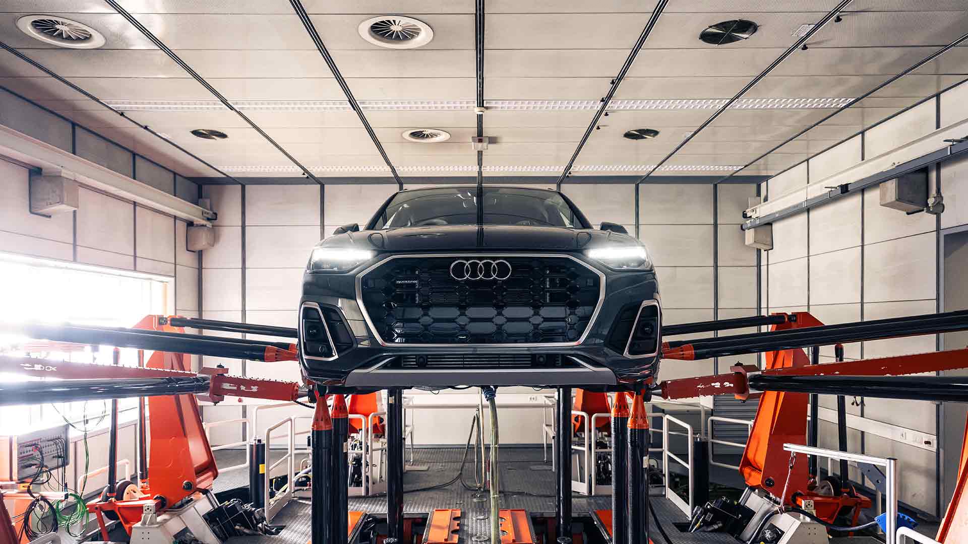 Right side profile view of an Audi Q8 SUV parked.