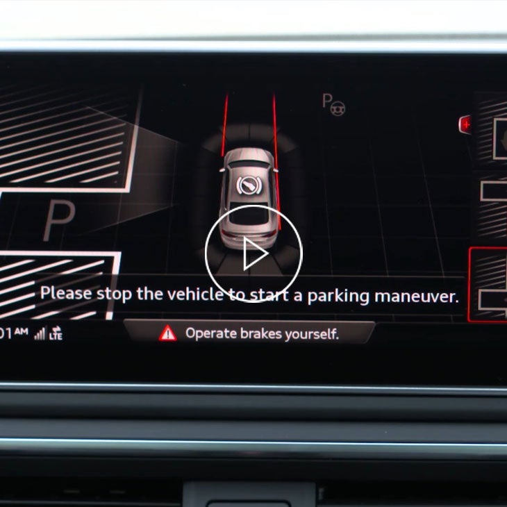 Close up on the MMI screen displaying the Audi park steering assist feature.