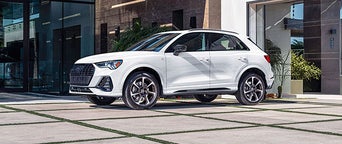 Three quarter view of an Audi Q3 parked.