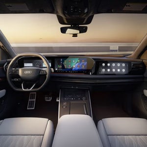 Audi SQ9 front cabin featuring the digital cockpit, MMI displays, steering wheel, and centre console.