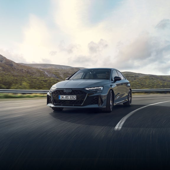 Front view of the Audi RS 3 in motion.