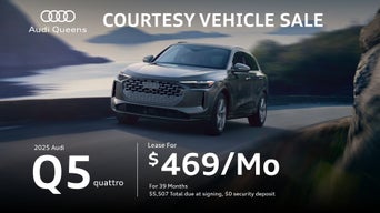 Front left view of an Audi Q5 accelerating.