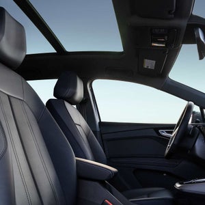 Audi Q4 e-tron interior with panoramic roof — schedule a test drive at Audi Sewickley near Pittsburgh