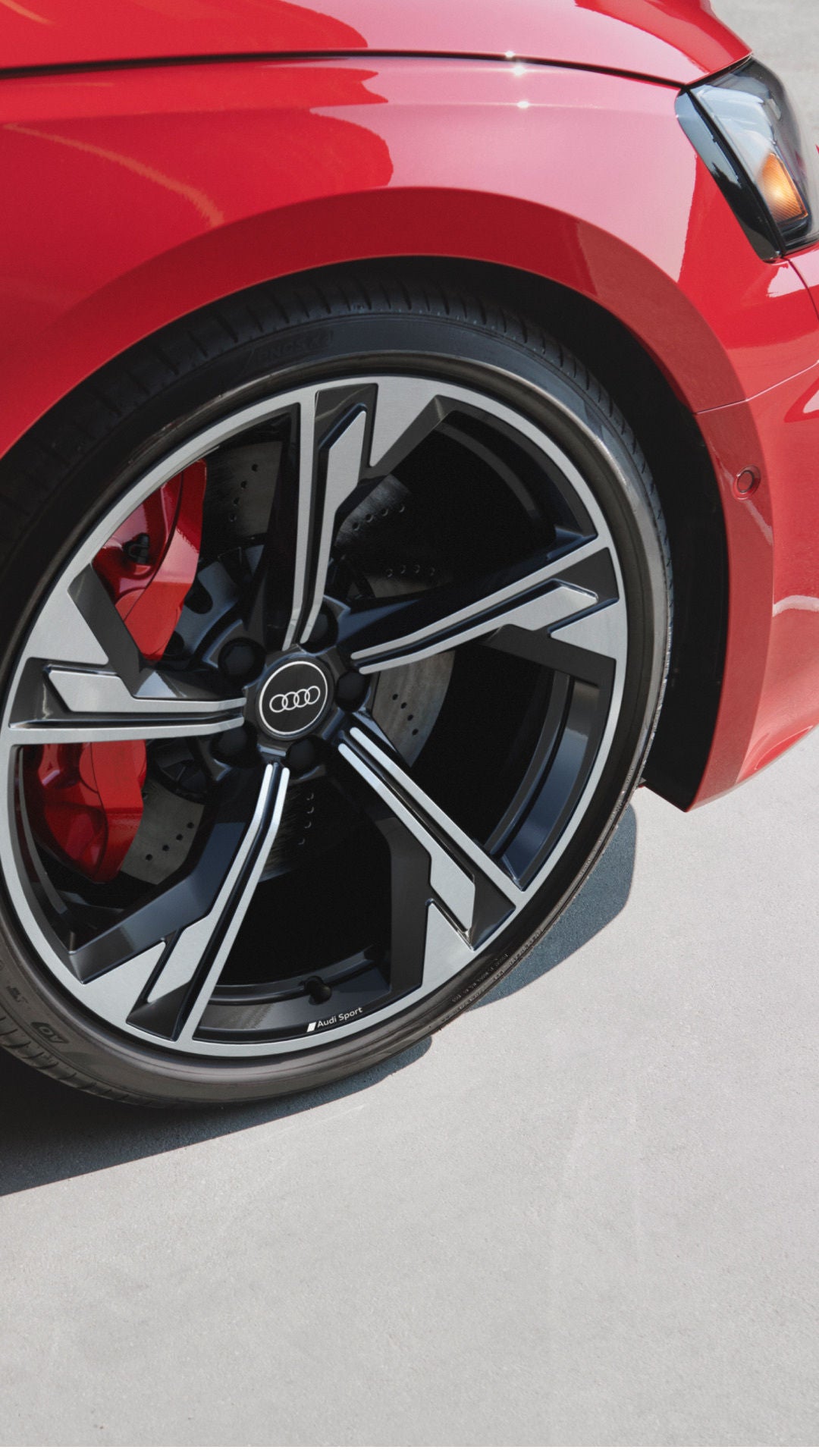 Side profile view of Audi wheel.