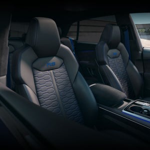 Interior view of the Audi RS Q8, showing the front sport seats.