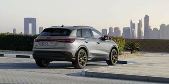 Q4 e-tron parked in front of the city