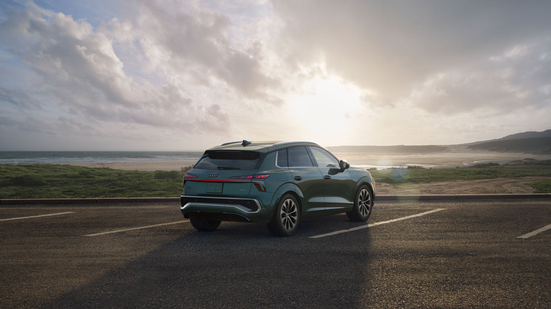 Q3 parked overlooking a sunset