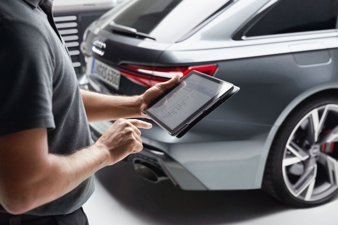 People offering service at Audi dealer