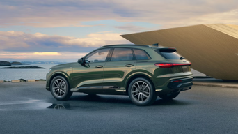 Three quarter profile view of an Audi Q5 accelerating.