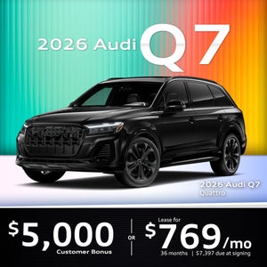 Side view of an Audi Q7 driving.