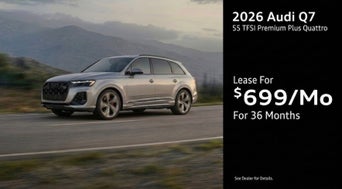 Three quarter view of an Audi Q7 driving.