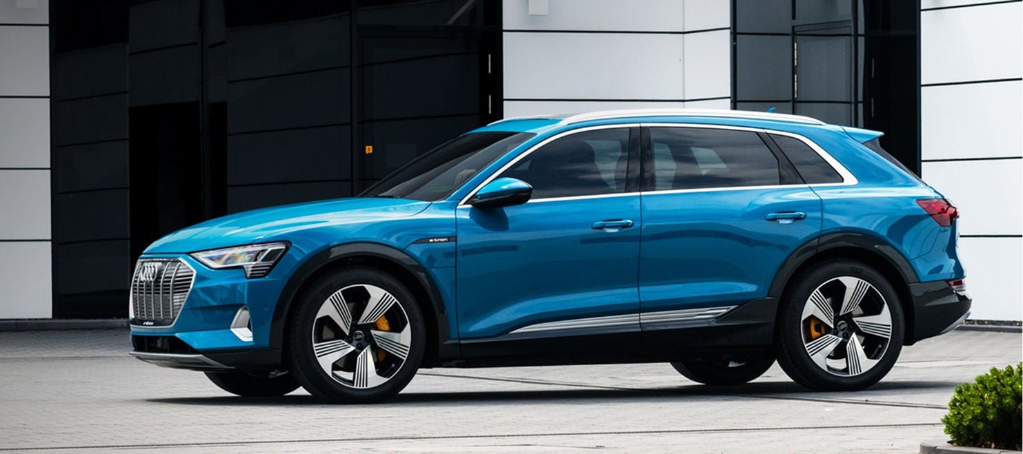 Right side profile view of an Audi SUV parked.