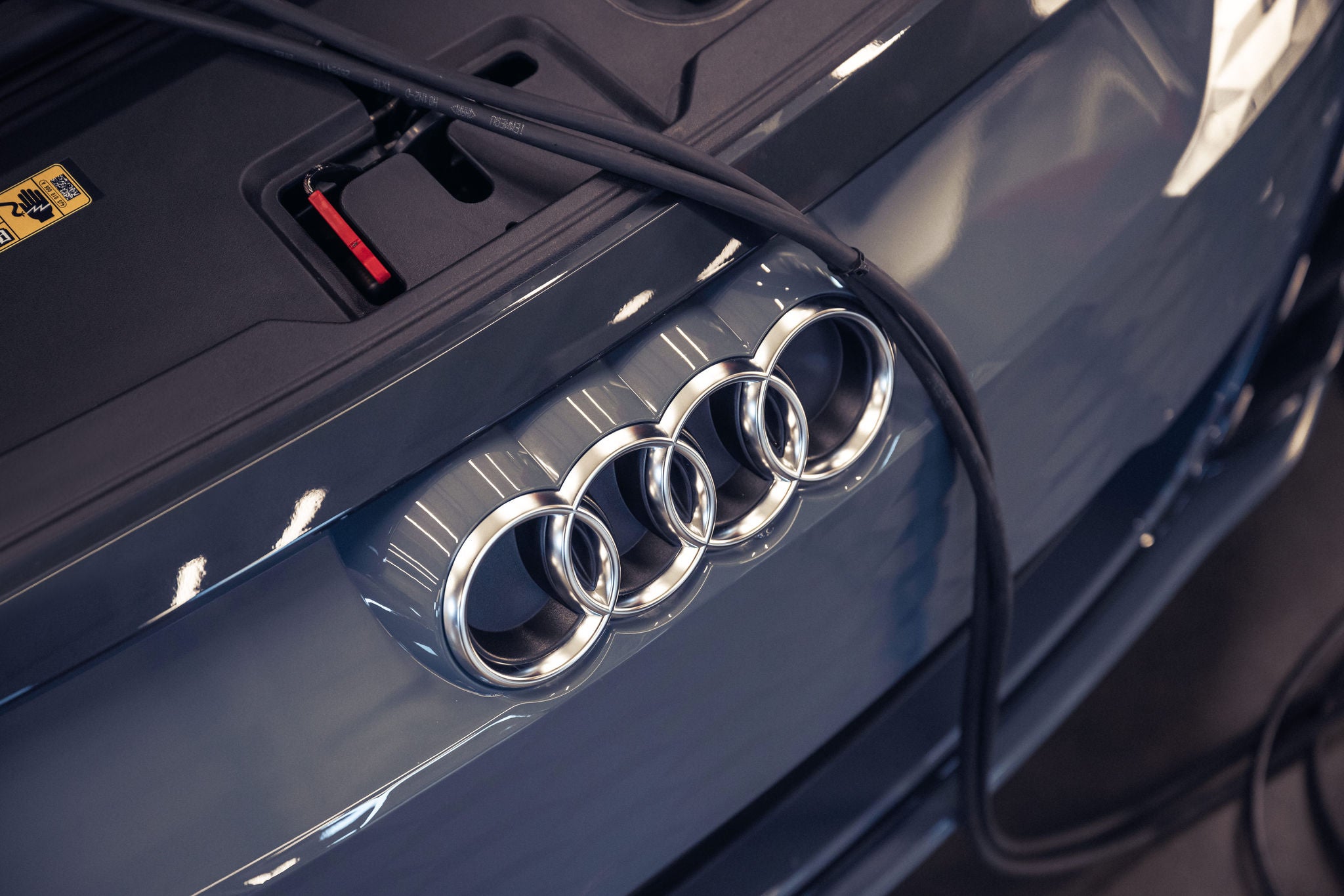 Front profile view of an Audi Q7 accelerating.
