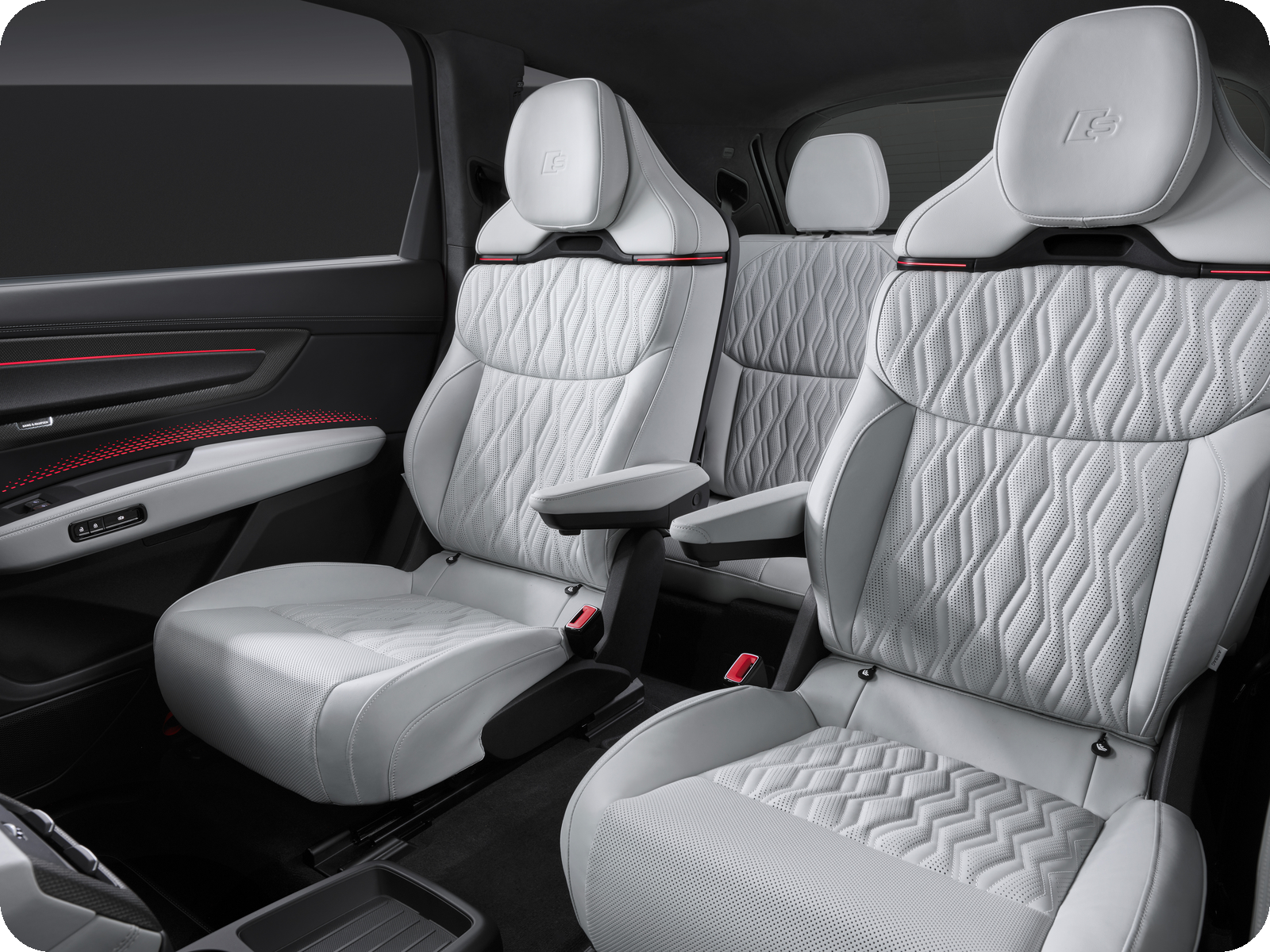 Audi Q9 interior — second-row captain’s chairs in quilted leather.