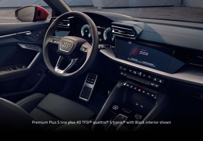 2026 Audi A3 Premium Plus S line with black interior, showing the steering wheel, digital cockpit and infotainment display.