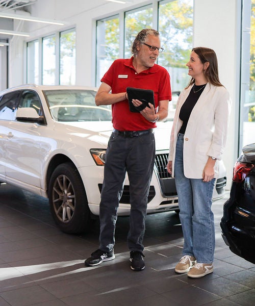 Rear profile view of an Audi Q5 parked.