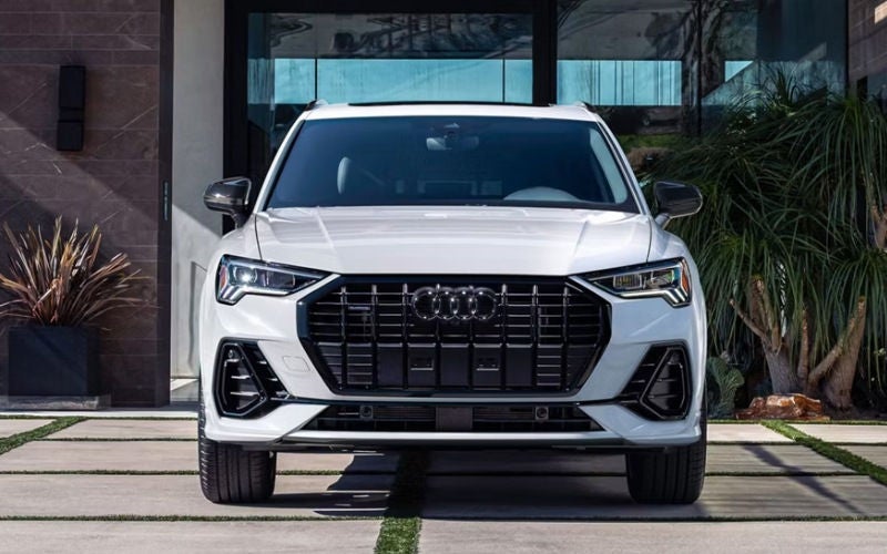 Which compact luxury SUV handles year-round traction better, the 2026 Audi Q3 or the 2026 Volvo XC40 around Lake Oswego, OR?