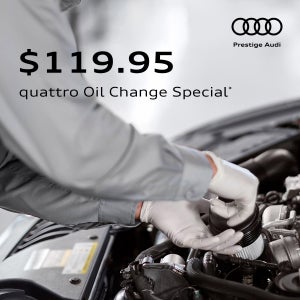 Audi technician installing an oil filter