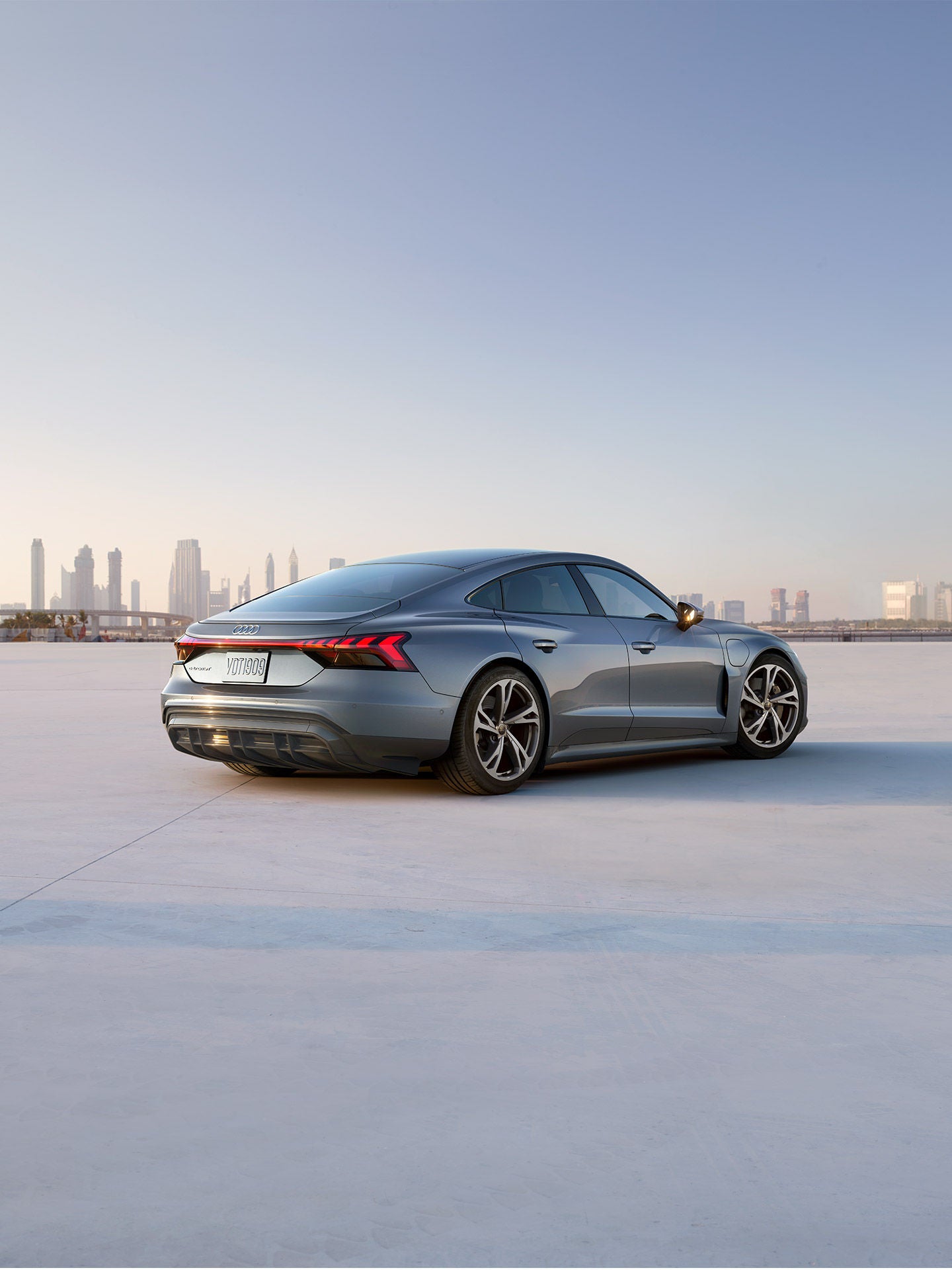 Three-quarter rear view of the Audi e-tron® GT. 