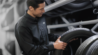 Audi service technician replacing tires