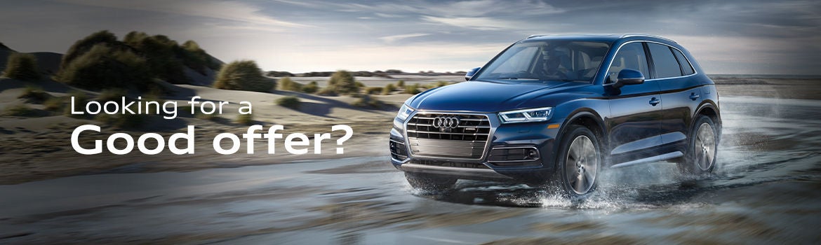 Three quarter view of an Audi Q8 SUV parked.