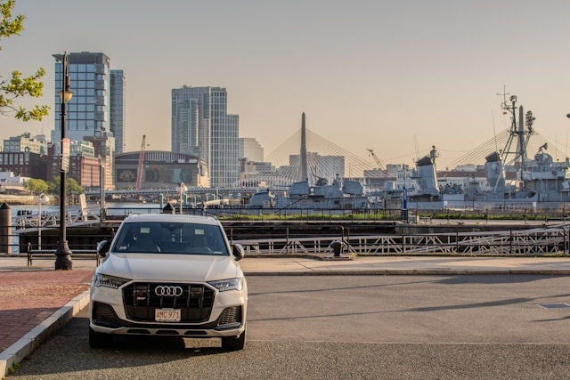 A luxury Audi sedan parking on a suburban street