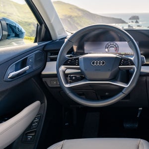 Close-up of the driver's cockpit of the Audi Q3, showing the Sonos sound system speakers inside the Audi Q3.